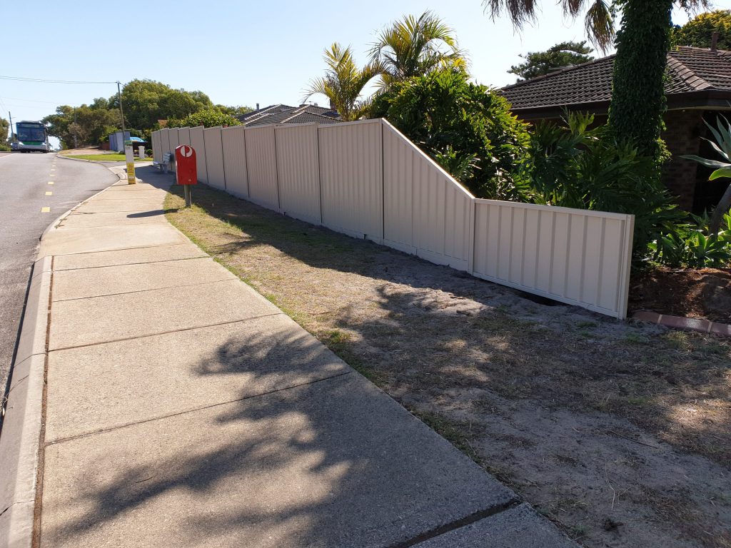 A house in Perth with colorbond fencing down the side.