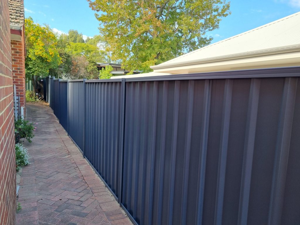 A colorbond fence installed by SureFence.