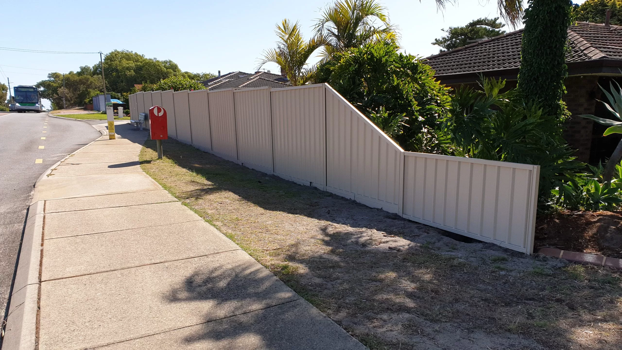 A house in Perth with colorbond fencing down the side.